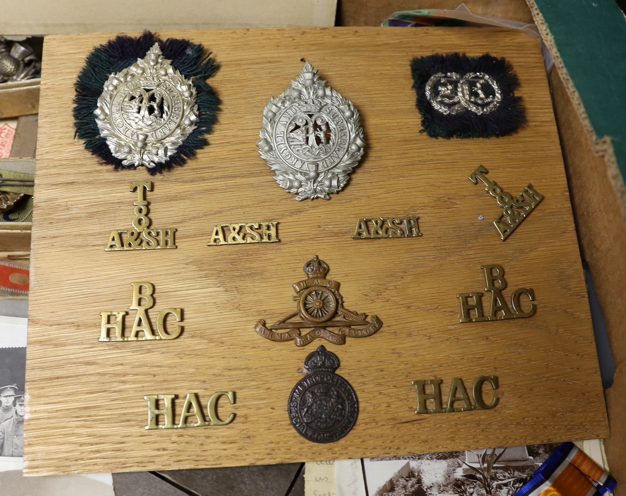 A WWI family medal group including trio awarded to 4872 PTE. A. D. BORROWMAN. A. & S. H., another medal 579 PTE. A. A . BORROWMAN. RIF. BRIG. A death plaque to ARTHUR ABRAHAM BORROWMAN, related photographs, caps, badges